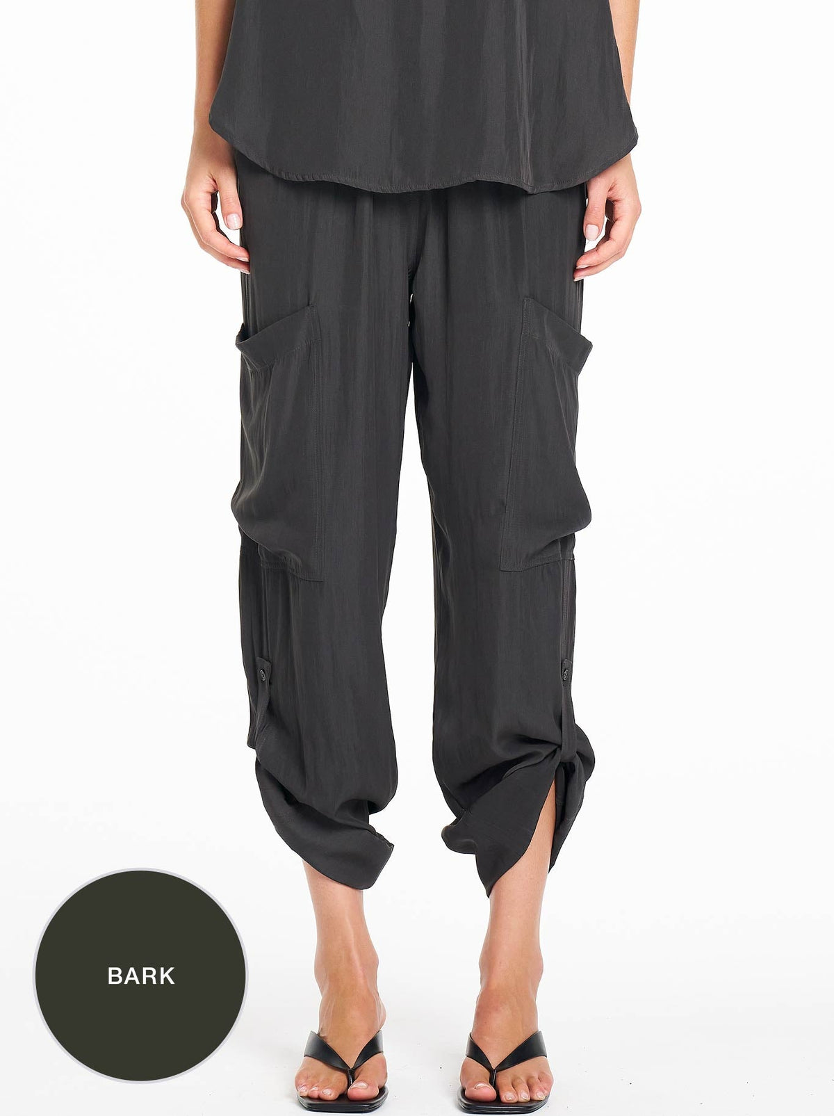 Image of a model wearing Pants. Product name - MELA PURDIE SOFT CARGO in Bark colour by brand - Mela Purdie