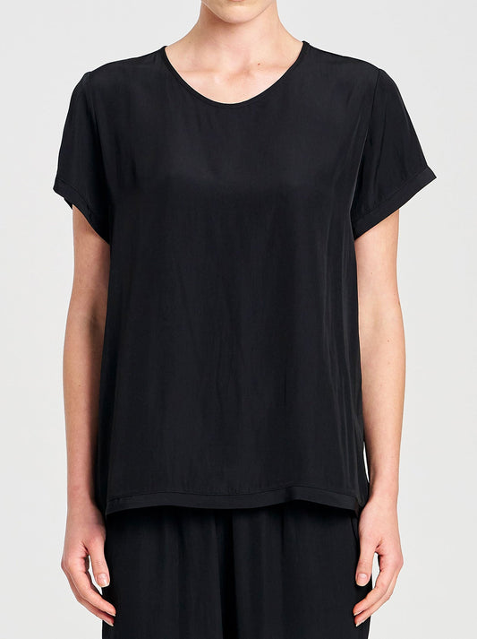 Image of a model wearing Tops. Product name - MELA PURDIE TRAVEL T in Black colour by brand - Mela Purdie
