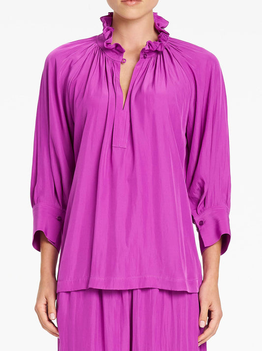 Image of a model wearing Tops. Product name - MELA PURDIE ROMAN BLOUSE in Dahlia colour by brand - Mela Purdie