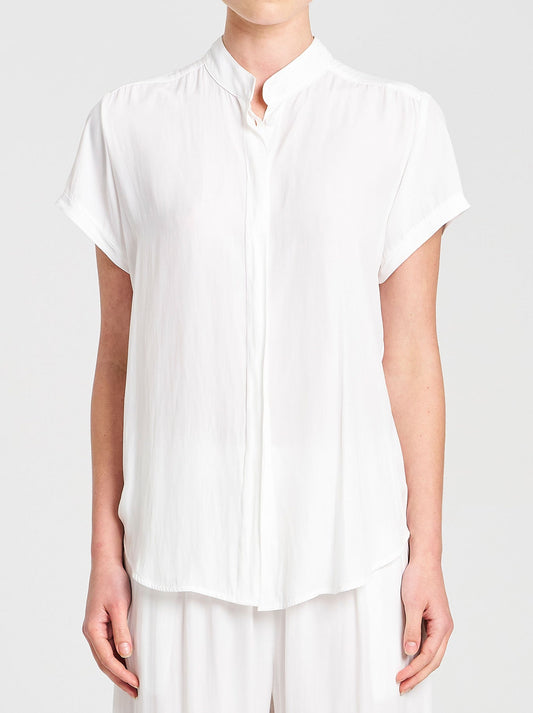 Image of a model wearing Tops. Product name - Mela Purdie Soft Stand Shirt in White colour by brand - Mela Purdie