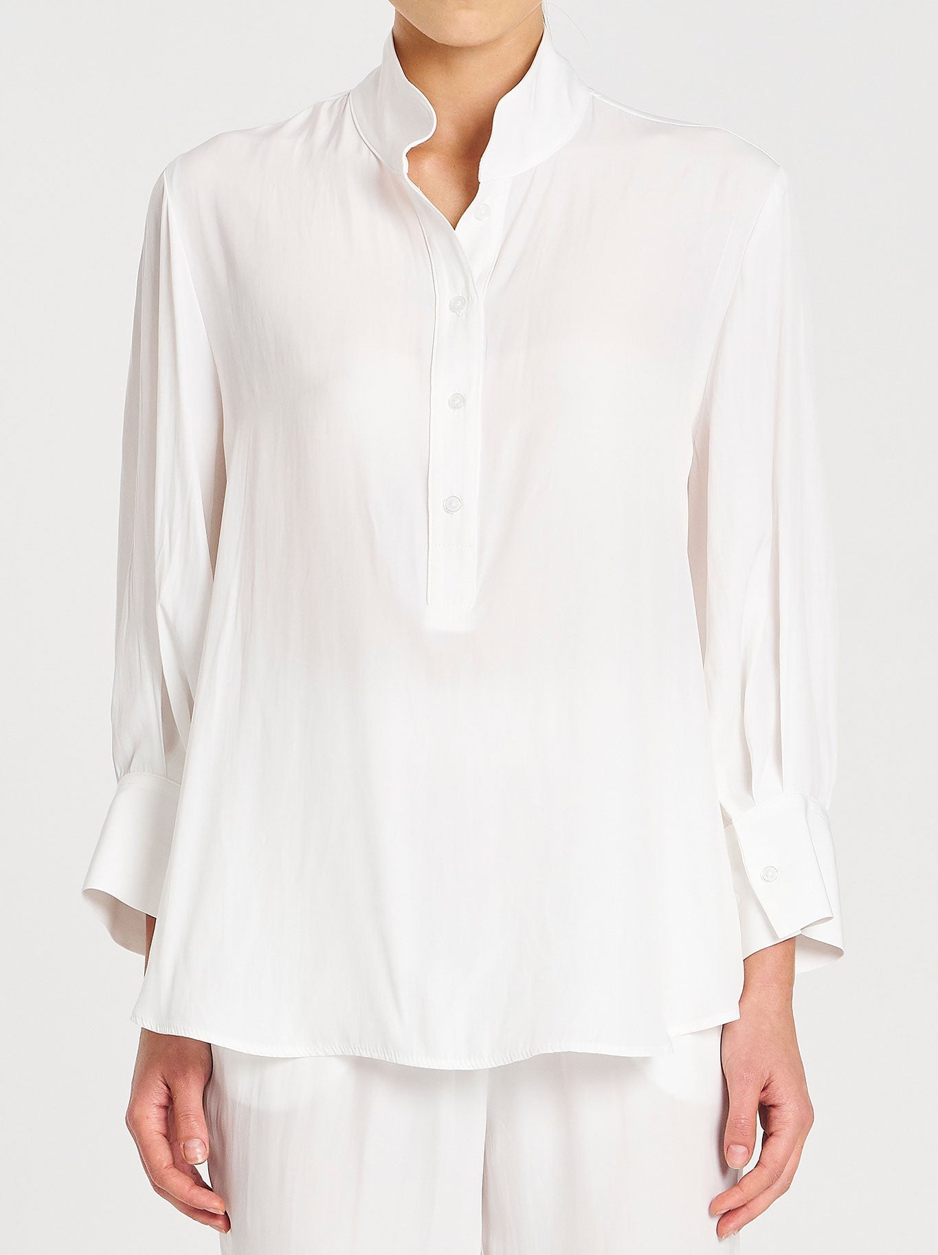Image of a model wearing Tops. Product name - Mela Purdie Resort Shirt in White colour by brand - Mela Purdie