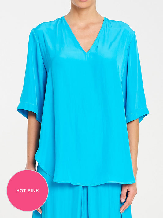 Image of a model wearing Tops. Productname: Mela Purdie Swish Plaza Top in Hot Pink colour by brand - Mela Purdie