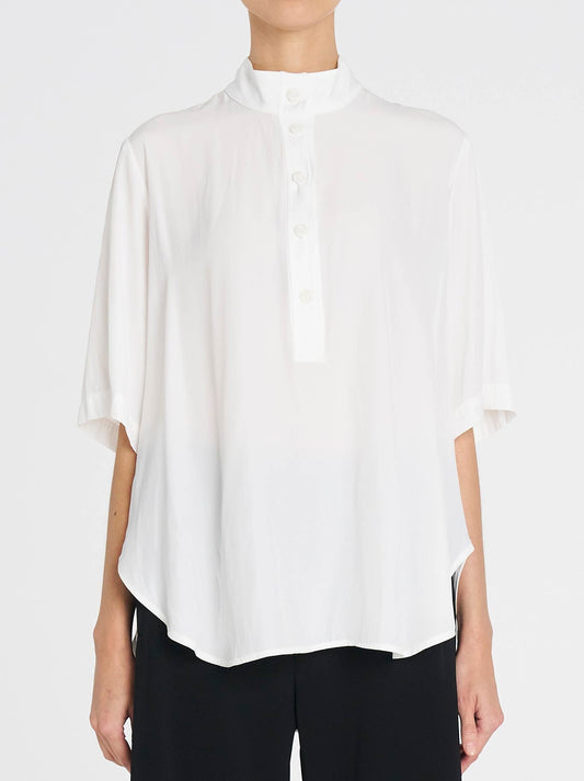 Image of a model wearing Tops. Productname: MELA PURDIE SWISH TAB PLAZA in White colour by brand - Mela Purdie