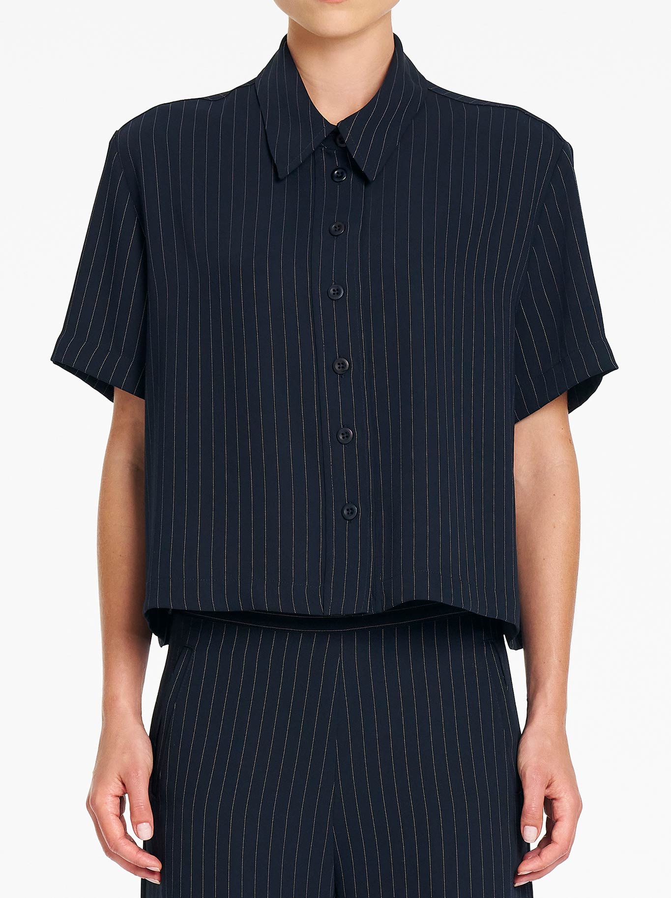 Image of a model wearing Tops. Product name - Mela Purdie Crop Shirt in Navy/Chalk colour by brand - Mela Purdie