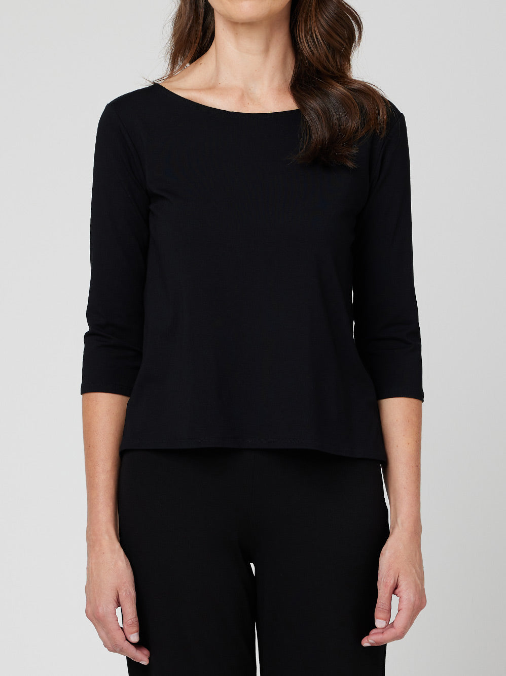 Image of a model wearing Tops. Product name - MELA PURDIE RELAXED BOAT NECK in Black colour by brand - Mela Purdie