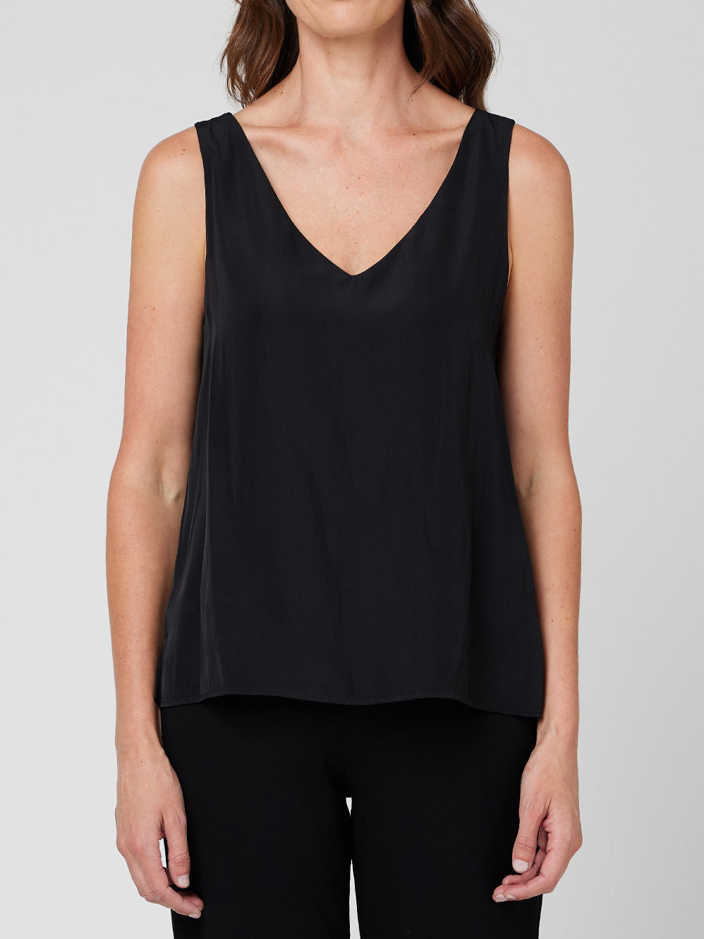 Image of a model wearing Tops. Productname: MELA PURDIE AUDREY TANK in Black colour by brand - Mela Purdie
