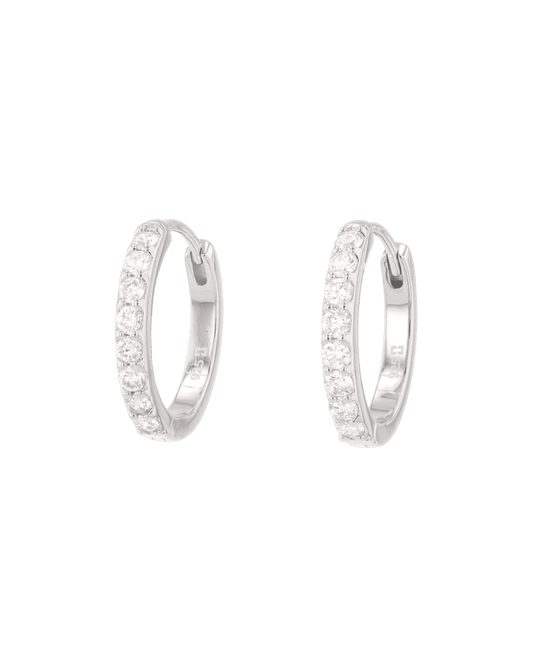 Image of Earrings. Product name - Miami Silver Diamond Huggie Earrings in colour by brand - LAVANA