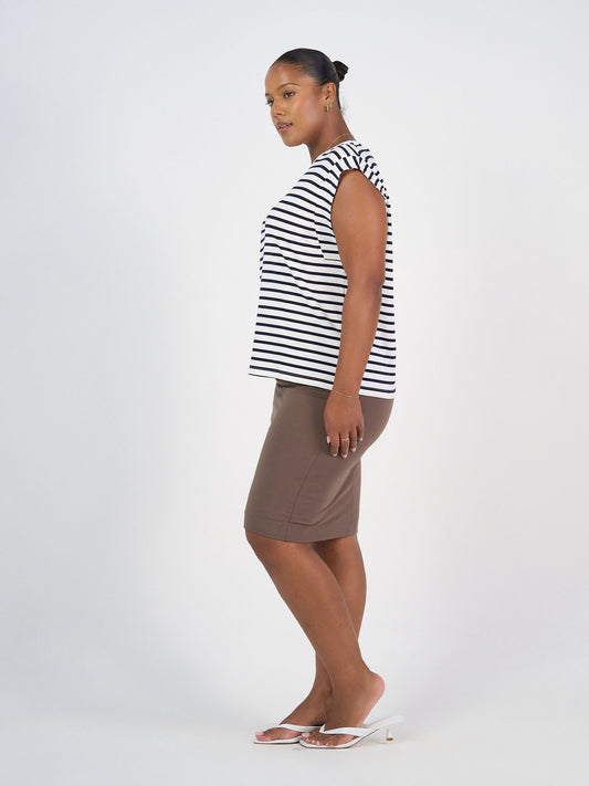 Image of a model wearing Skirts. Product name - Midi Bamboo Whitney Tube Skirt Chocolate in Chocolate colour by brand - Lou Lou
