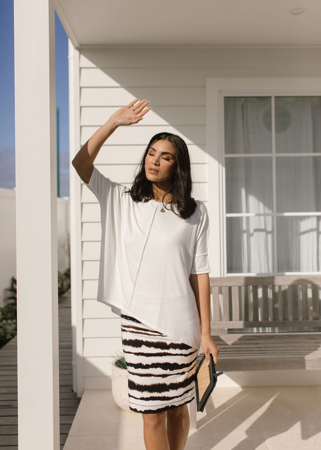 Image of a model wearing Skirts. Product name - Midi Bamboo Whitney Tube Skirt Tie Dye in Tie Dye colour by brand - Lou Lou