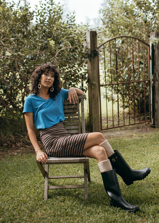 Image of a model wearing Skirts. Product name - Midi Bamboo Whitney Tube Skirt Chocolate & Black Stripe in Chocolate & Black Stripe colour by brand - Lou Lou