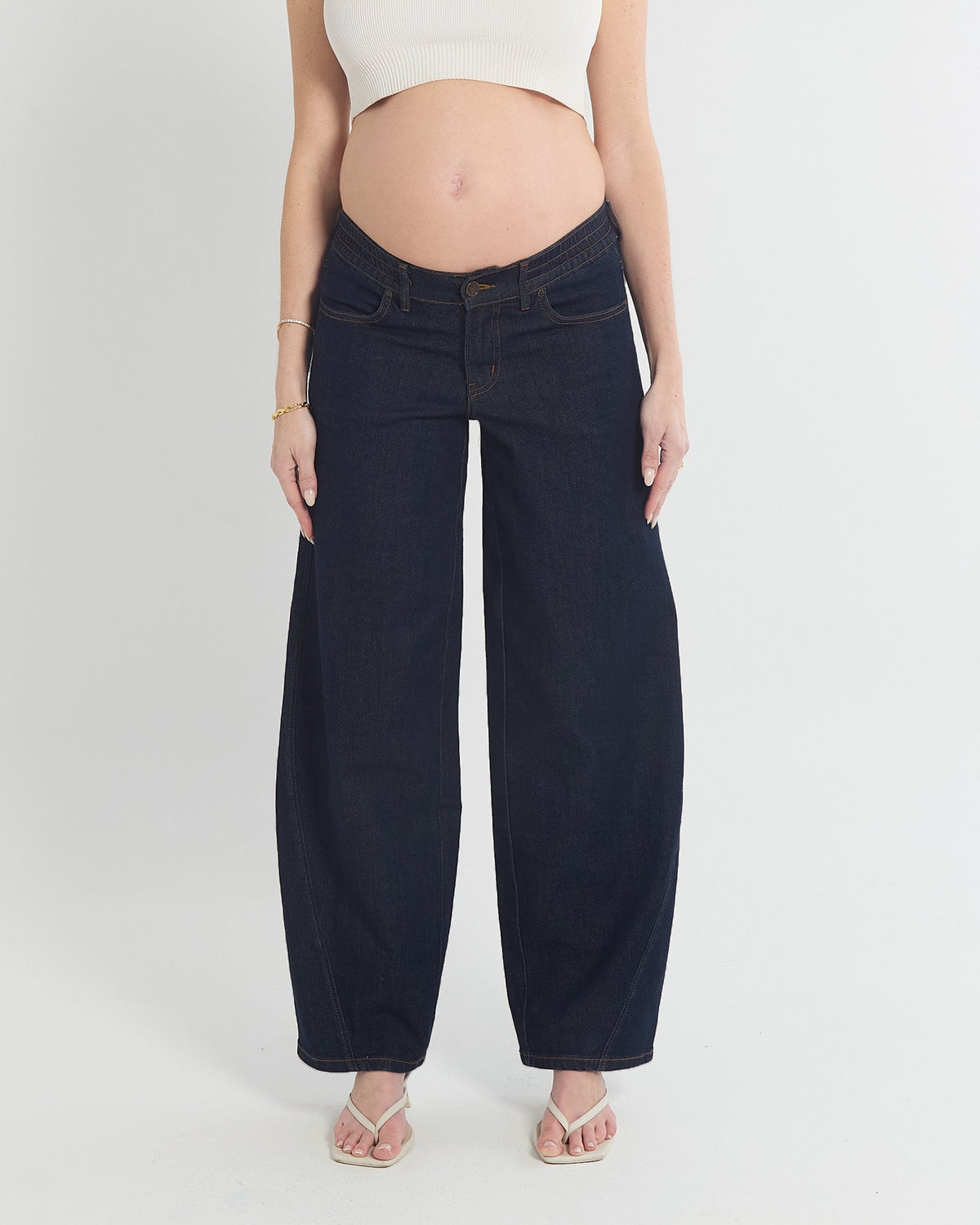 Image of a model wearing Pants. Product name - Milo Barrel Leg Jeans in colour by brand - Soon Maternity