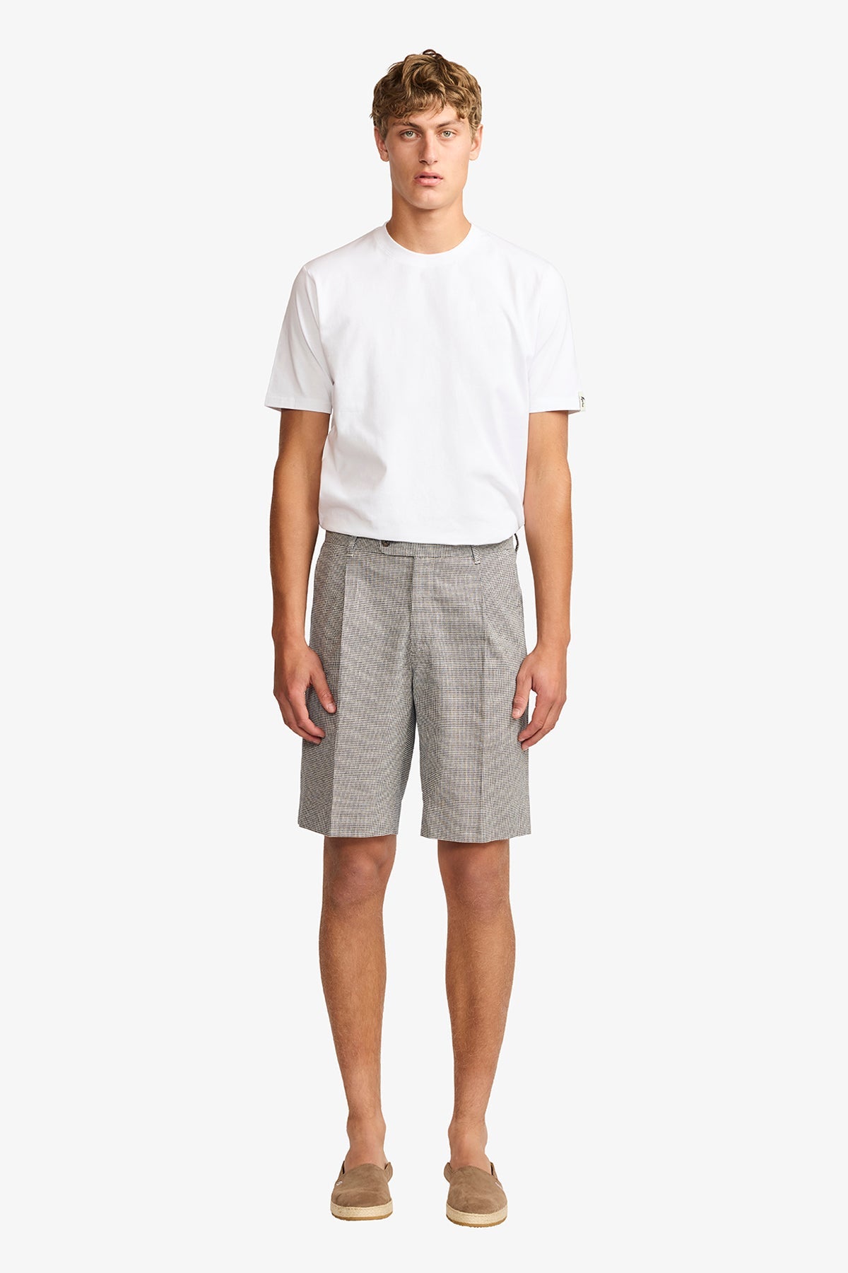 Image of a model wearing Shorts. Product name - Modena linen shorts in Shorts colour by brand - Anthony Squires