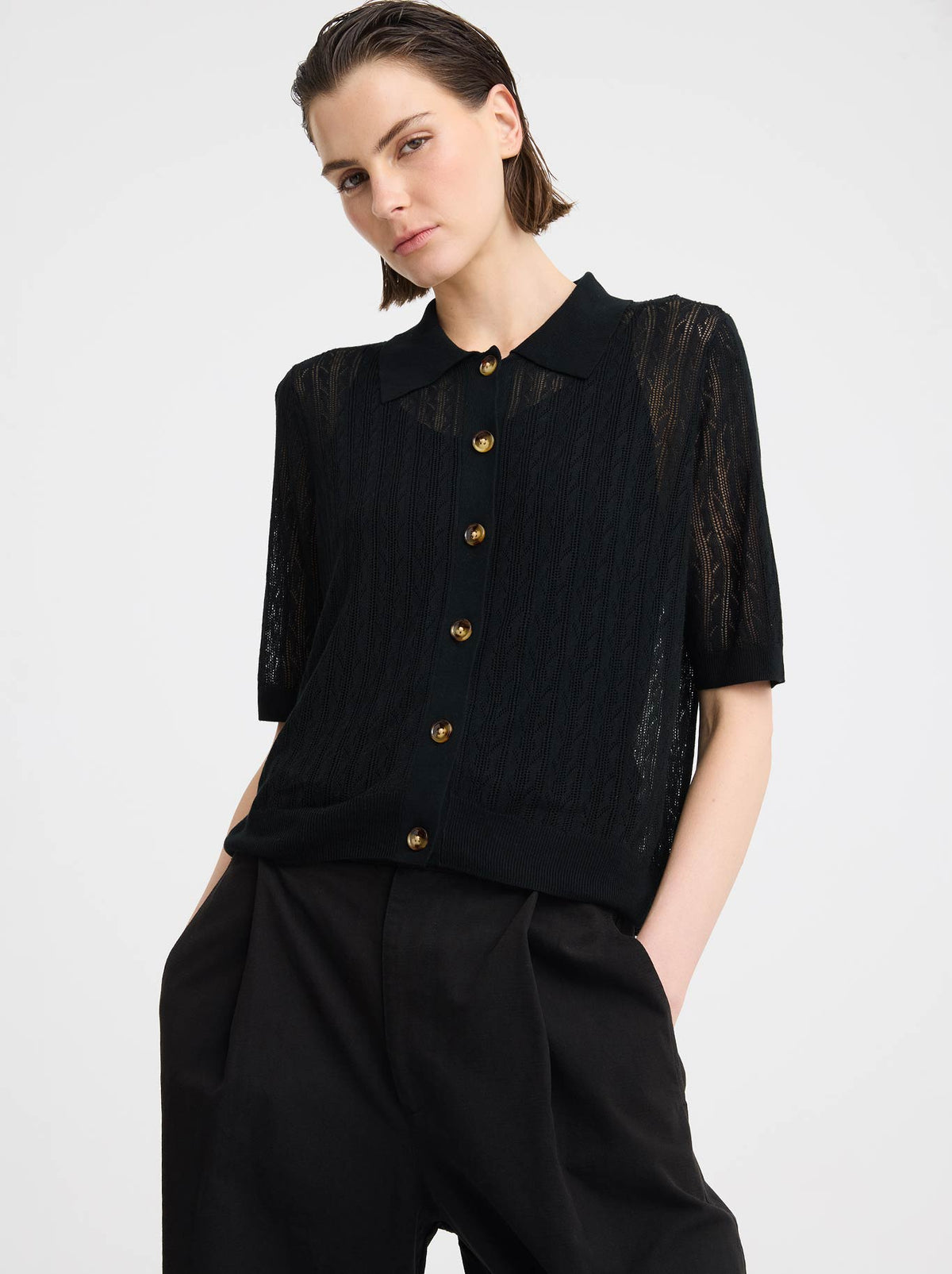 Image of a model wearing Outerwear. Product name - MORRISON BRIONI KNIT CARDI in Black colour by brand - Morrison