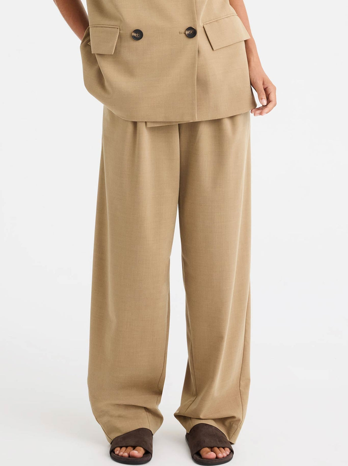 Image of a model wearing Pants. Product name - MORRISON BRIXTON PANT in Biscuit colour by brand - Morrison