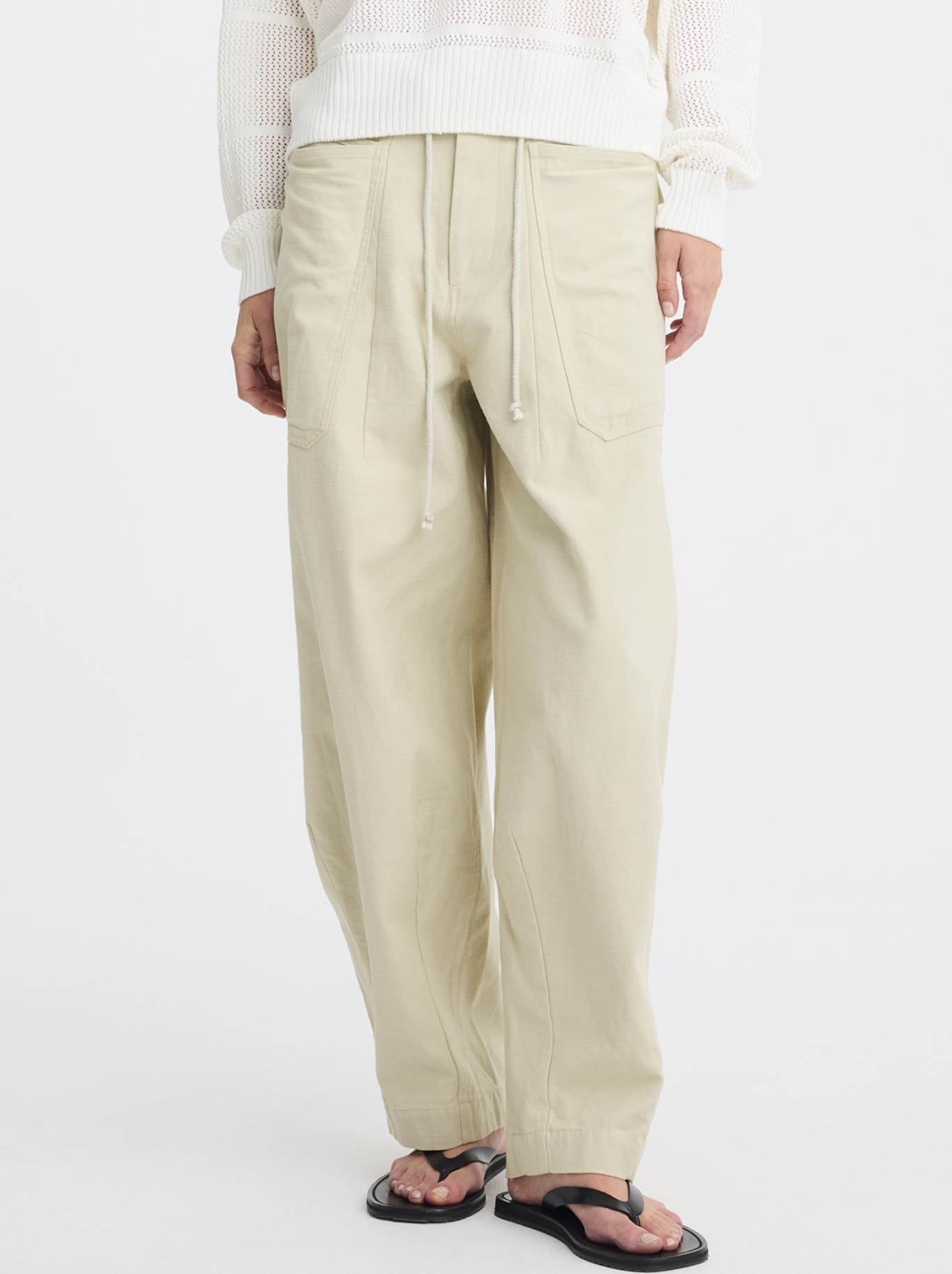 Image of a model wearing Pants. Product name - MORRISON CHARLIE CARGO PANT in Chalk colour by brand - Morrison