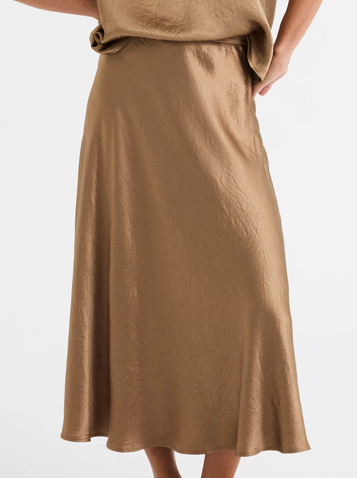 Image of a model wearing Skirts. Product name - MORRISON JASMINE SKIRT in Bronze colour by brand - Morrison