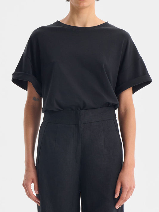 Image of a model wearing Tops. Productname: MORRISON RORY TEE in Black colour by brand - Morrison