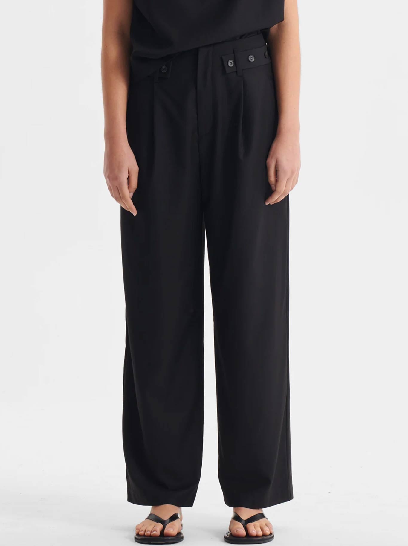 Image of a model wearing Pants. Productname: MORRISON SEBASTIAN PANT in Black colour by brand - Morrison