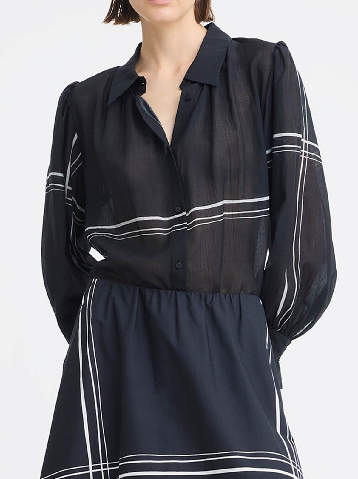 Image of a model wearing Tops. Product name - MORRISON VICTOR BLOUSE in Print colour by brand - Morrison