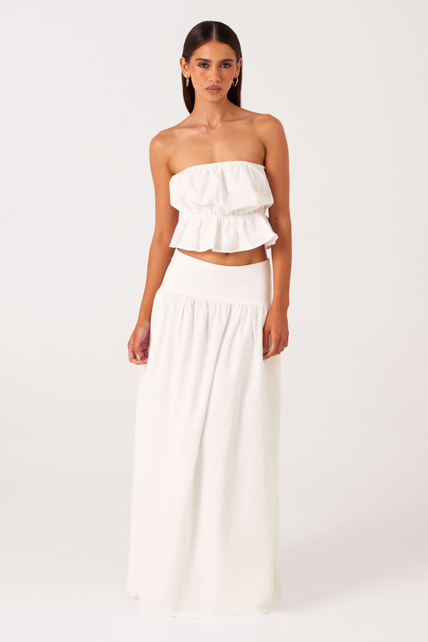 Image of a model wearing Skirts. Productname: SNDYS NESA MAXI SKIRT in White colour by brand - SNDYS
