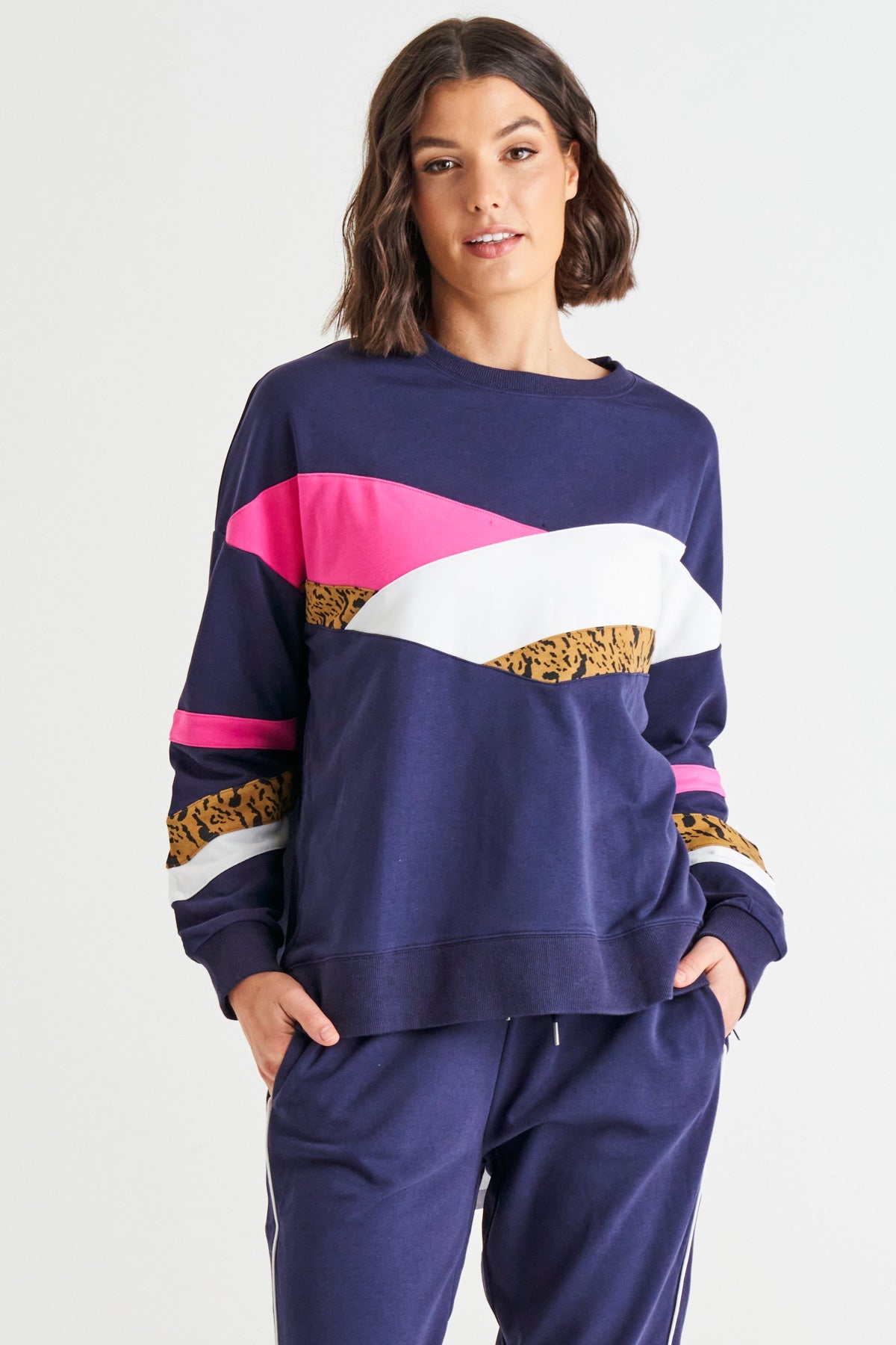 Image of a model wearing Outerwear. Productname: Betty Basics Addie Comfy Cotton Sporty Sweat Blue Chevron Splice in Blue Splice colour by brand - Betty Basics