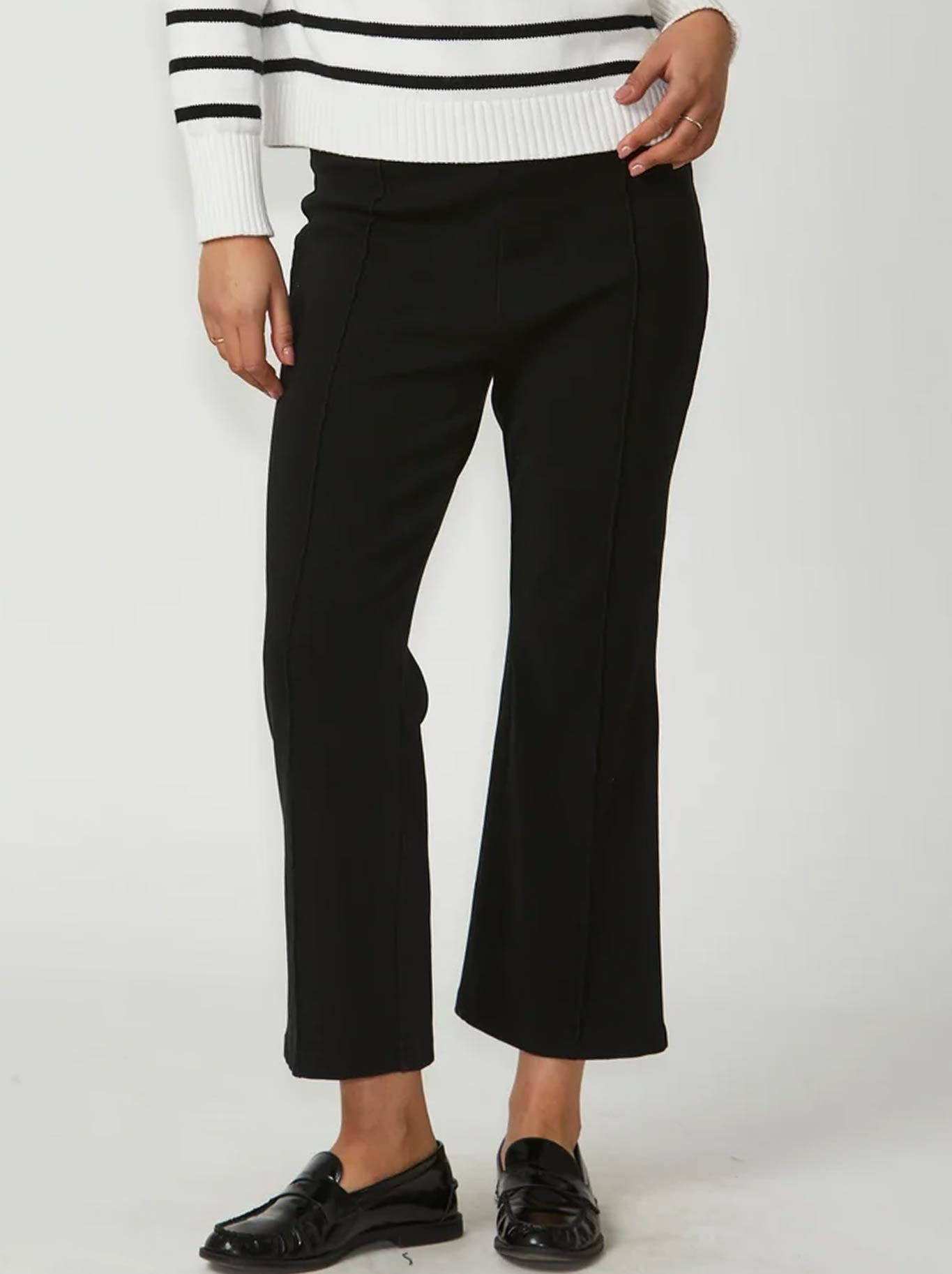 Image of a model wearing Pants. Product name - New London Jagger Flare Cropped Pant in Black colour by brand - New London