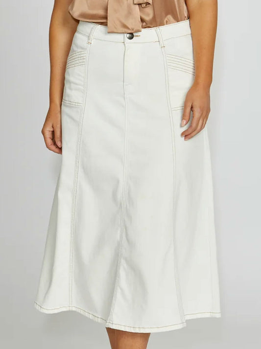 Image of a model wearing Skirts. Product name - NEW LONDON KENLEY MIDI SKIRT in Milk Tan colour by brand - New London