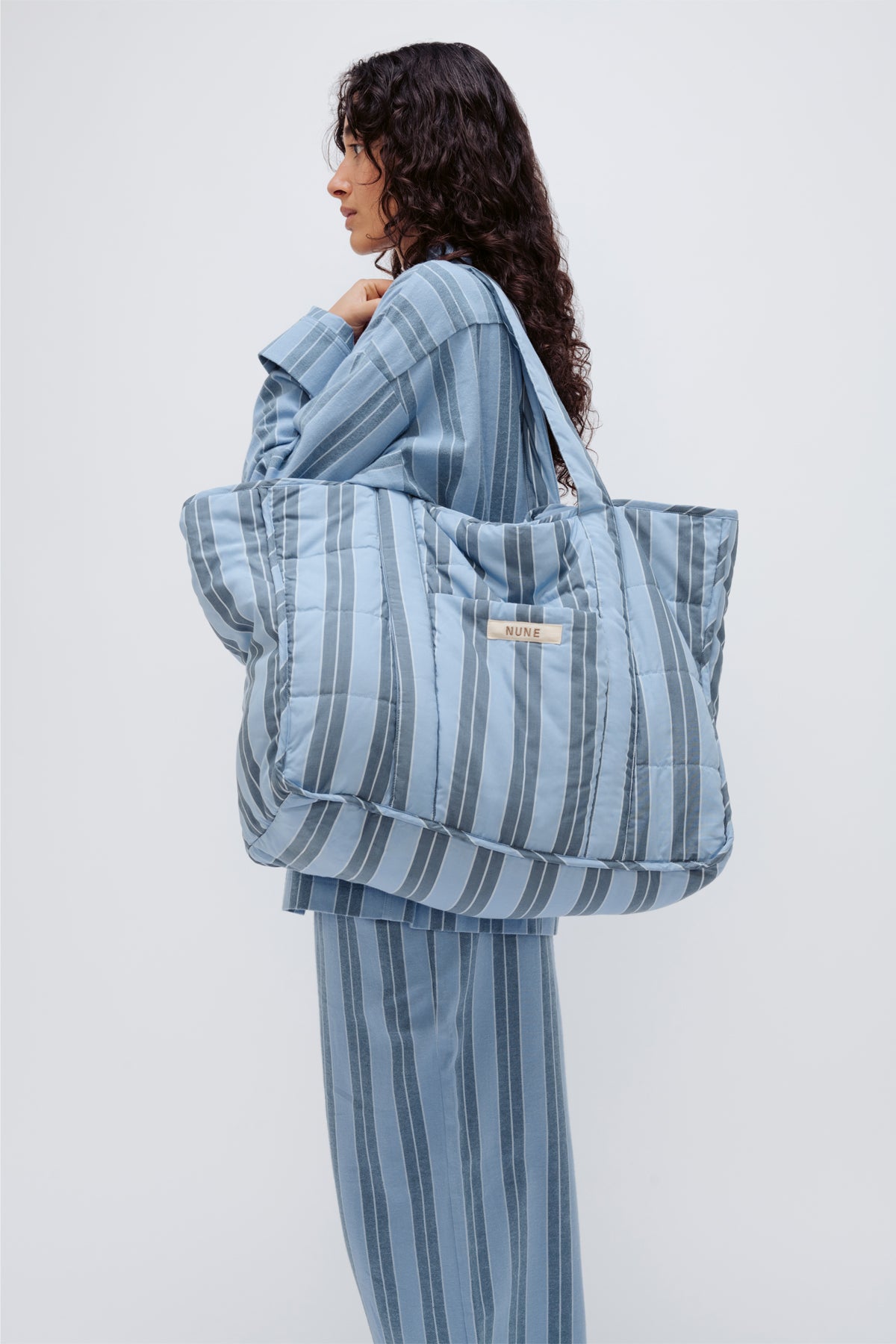 Image of Accessories. Product name - Doona Tote Daybreak Stripe in Daybreak Stripe colour by brand - NUNE
