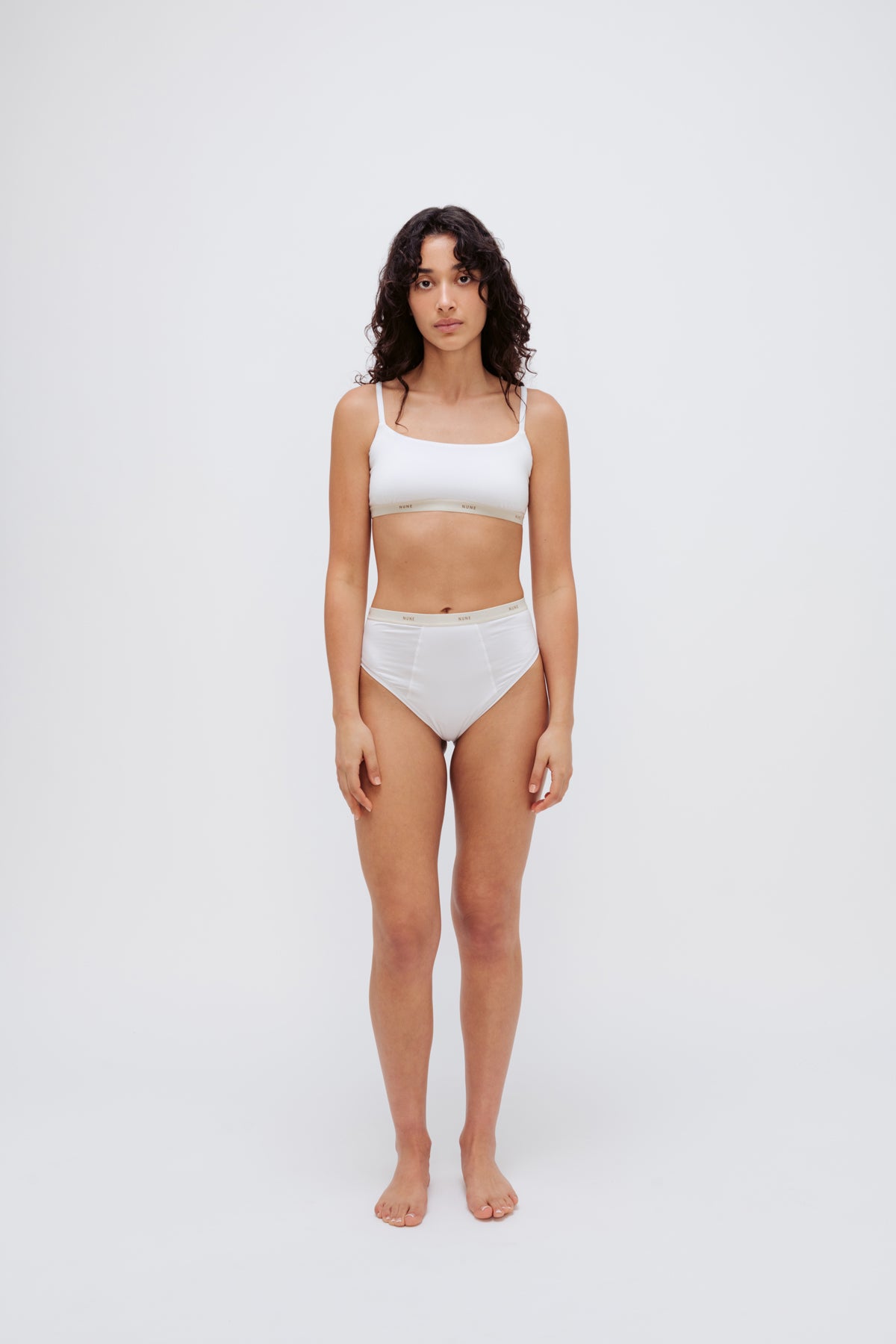Image of a model wearing Tops. Product name - Square Neck Bralette Daybreak in Daybreak colour by brand - NUNE