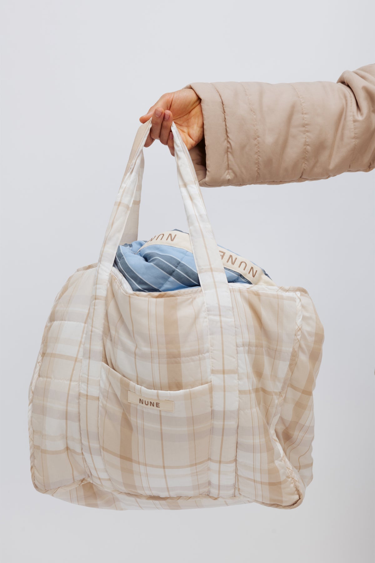 Image of Accessories. Product name - Doona Tote Oat Check in Oat Check colour by brand - NUNE