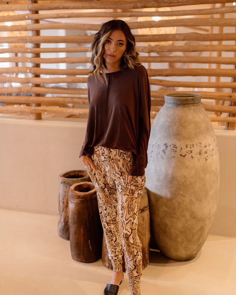 Image of a model wearing Tops. Product name - Stella Longsleeve Oversized Bamboo Slouch Top Chicory Coffee in Chicory Coffee colour by brand - Lou Lou