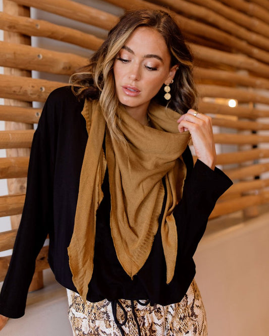 Image of a model wearing Outerwear. Product name - Sassoon Cashmere/Bamboo Scarf Cumin in Cumin colour by brand - Lou Lou