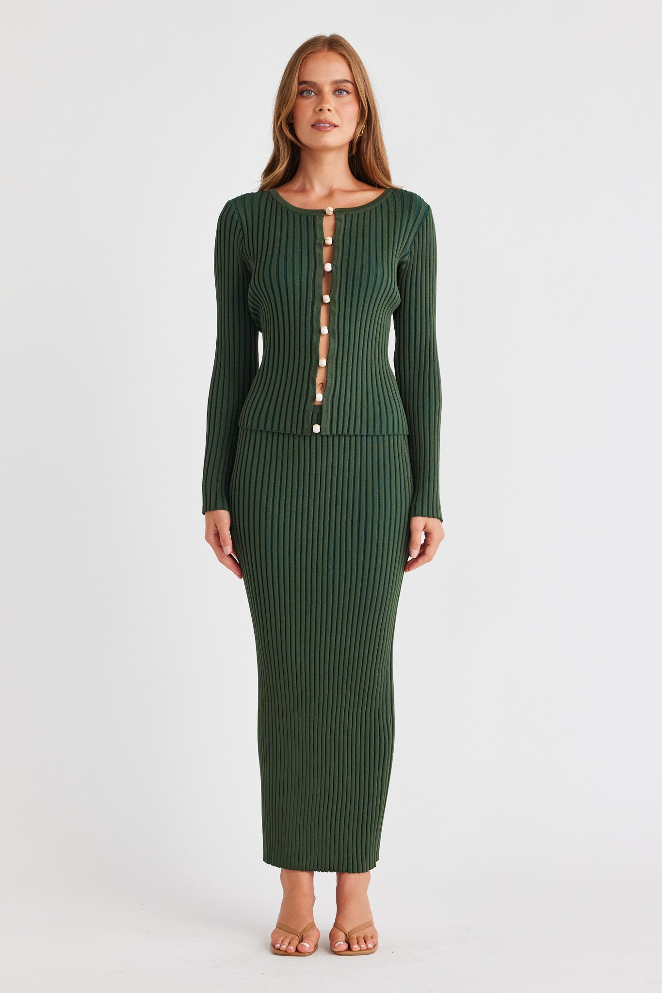 Image of a model wearing Skirts. Productname: SNDYS ODETTA MAXI SKIRT in Wild Green colour by brand - SNDYS