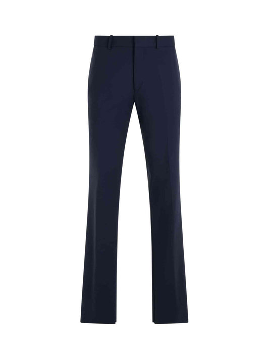 Image of a model wearing Pants. Productname: OFF-WHITE OW Embroidered Slim Fit Pant in NAVY colour by brand - OFF-WHITE