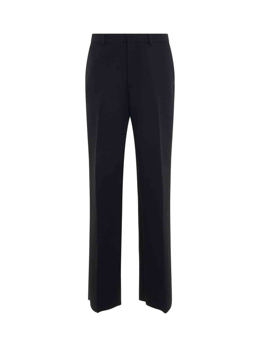 Image of a model wearing Pants. Productname: OFF-WHITE OW Embroidered Tailor Pant in BLACK colour by brand - OFF-WHITE