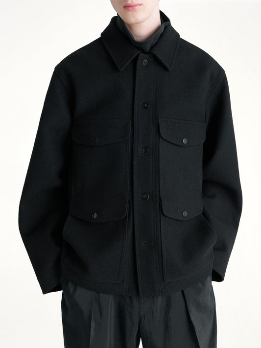 Image of a model wearing Outerwear. Productname: LEMAIRE Utility Jacket in Black colour by brand - LEMAIRE