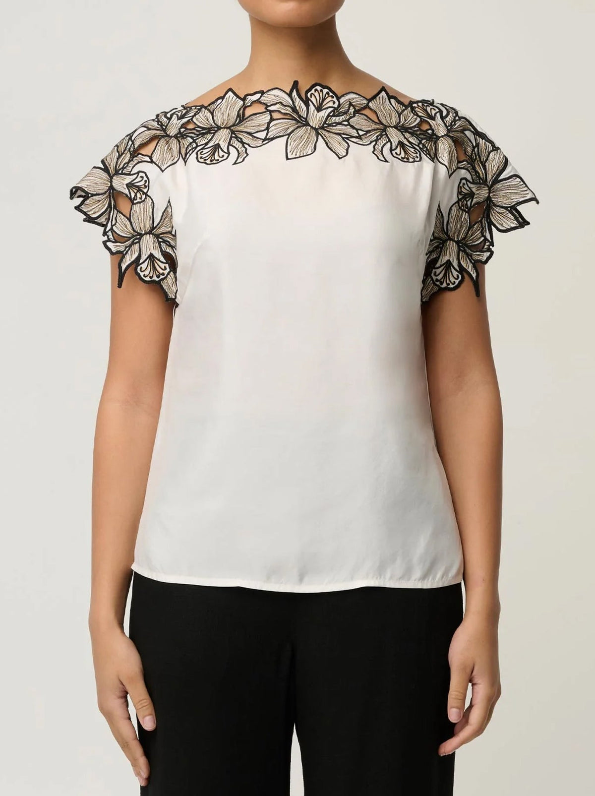 Image of a model wearing Tops. Product name - ONCE WAS ELEANOR TOP in Ivory colour by brand - Once Was