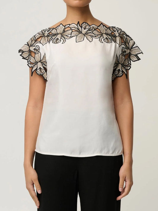 Image of a model wearing Tops. Product name - ONCE WAS ELEANOR TOP in Ivory colour by brand - Once Was