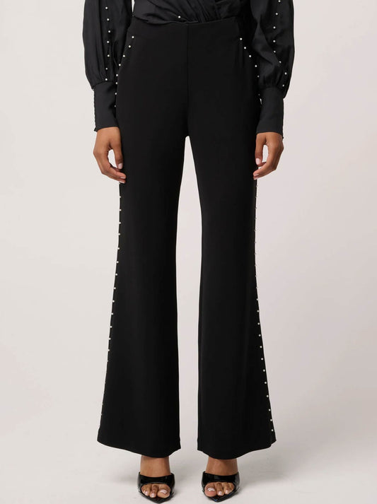 Image of a model wearing Pants. Product name - Once Was Marcela Pant in Black colour by brand - Once Was