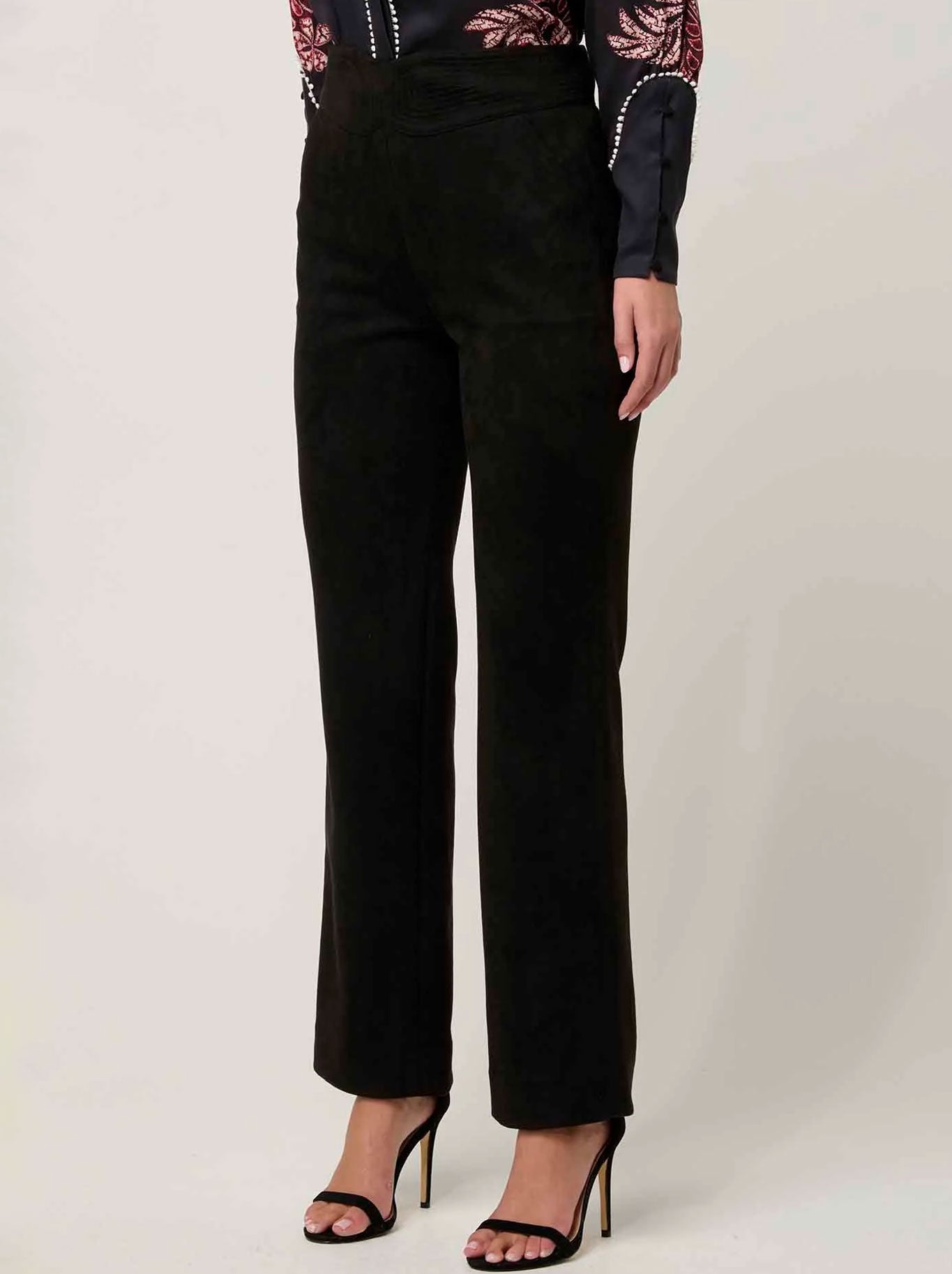 Image of a model wearing Pants. Product name - ONCE WAS SCARLETT FAUX SUEDE PANT in Onyx colour by brand - Once Was