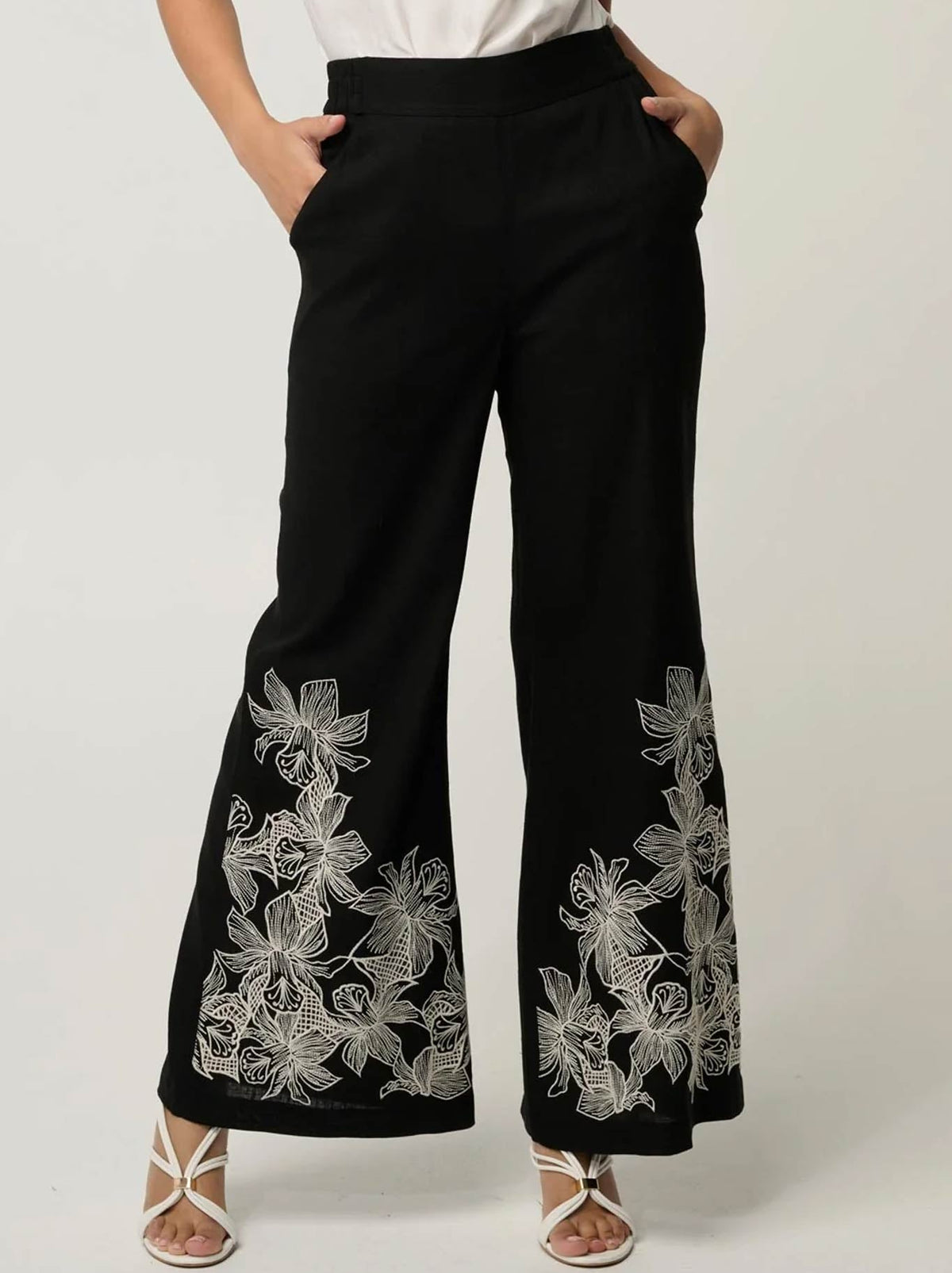 Image of a model wearing Pants. Product name - ONCE WAS WILLOW PANT in Black colour by brand - Once Was