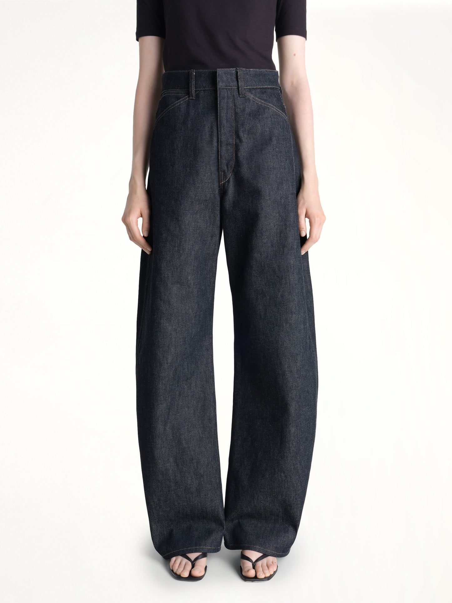 Image of Jeans. Product name - High Waisted Curved Pants in Indigo colour by brand - LEMAIRE
