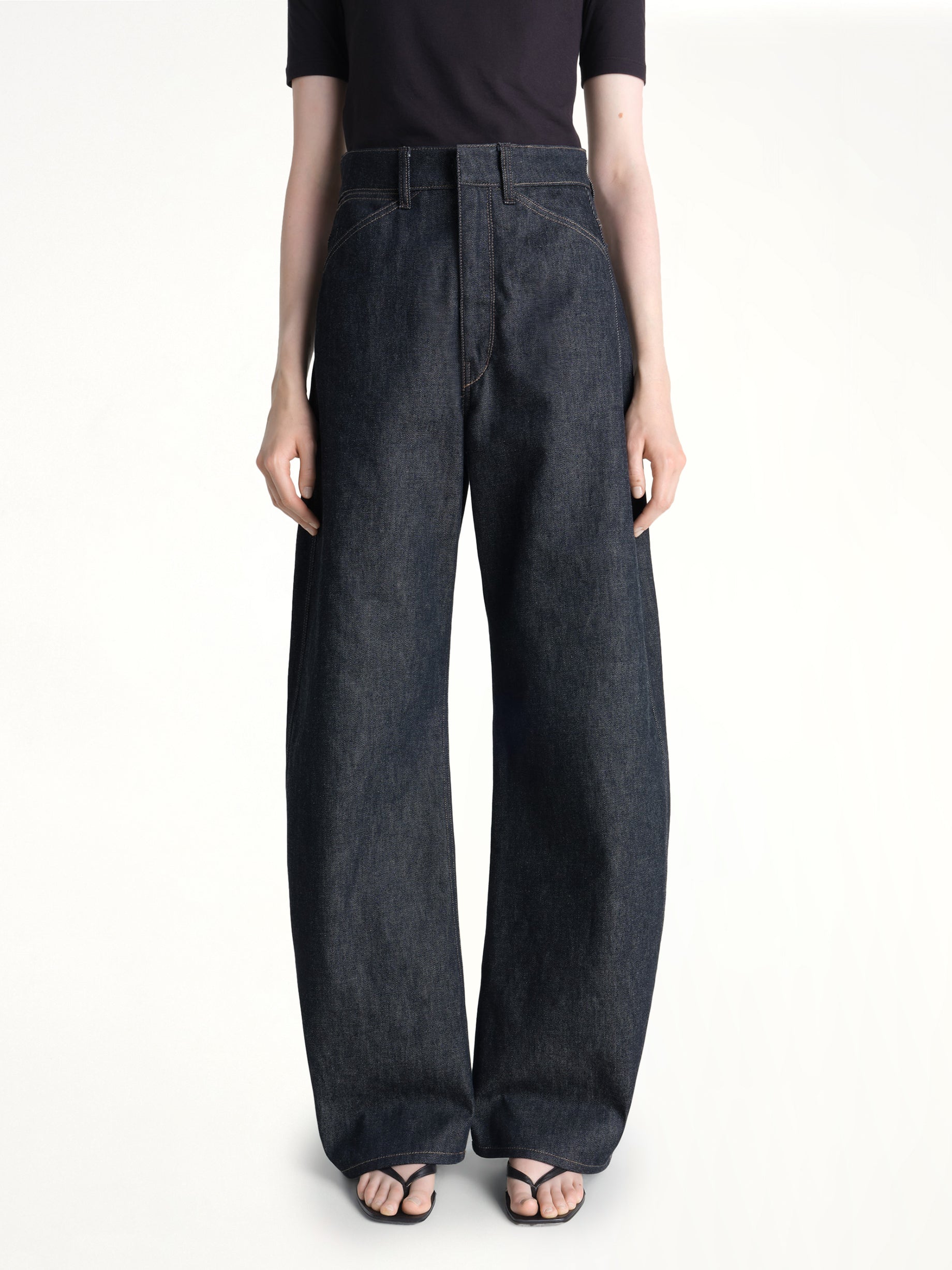 Image of Jeans. Product name - High Waisted Curved Pants in Indigo colour by brand - LEMAIRE