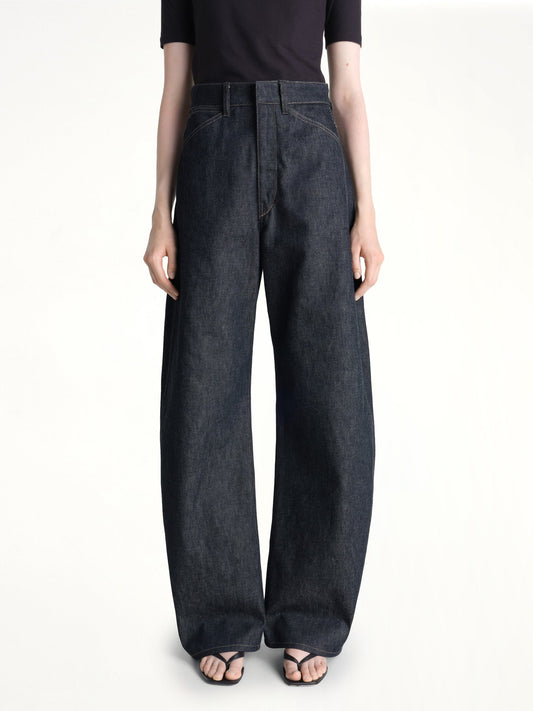 Image of Jeans. Product name - High Waisted Curved Pants in Indigo colour by brand - LEMAIRE