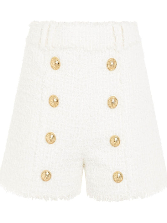 Image of a model wearing Shorts. Productname: BALMAIN High Waisted 8 Buttons Shorts in White colour by brand - BALMAIN