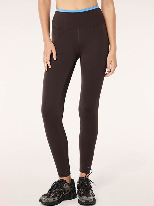 Image of a model wearing Pants. Product name - P.E NATION VITA FULL LENGTH LEGGING in Coffee Marina colour by brand - P.E Nation