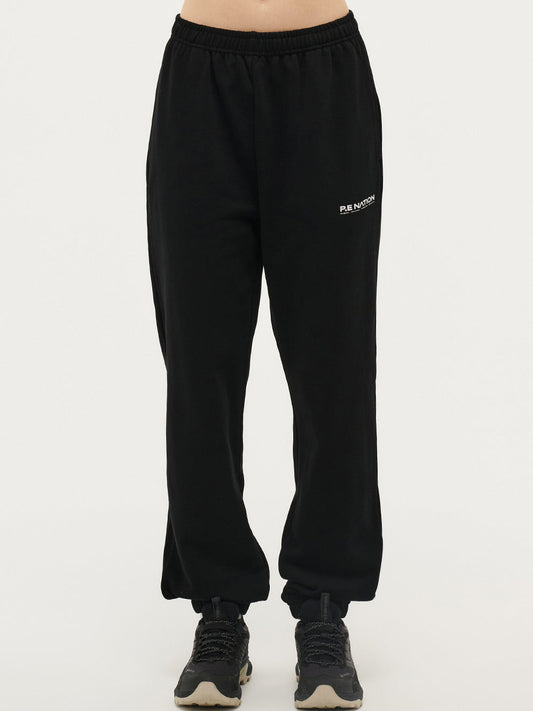 Image of a model wearing Pants. Productname: P.E NATION QUALIFY PANT in Black colour by brand - P.E Nation