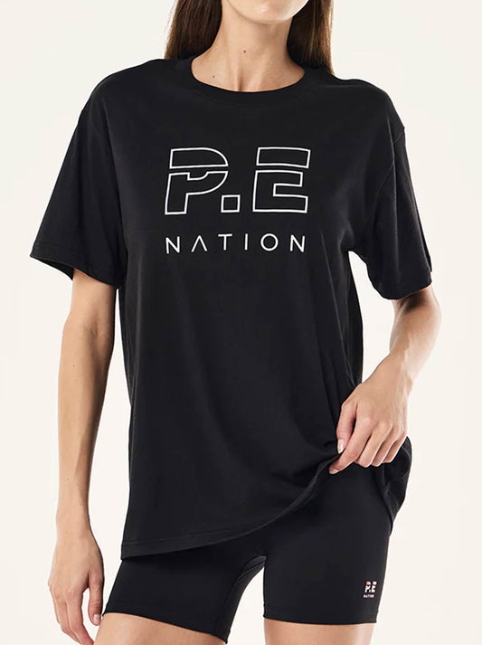 Image of a model wearing Tops. Productname: P.E NATION HEADS UP TEE in Black colour by brand - P.E Nation
