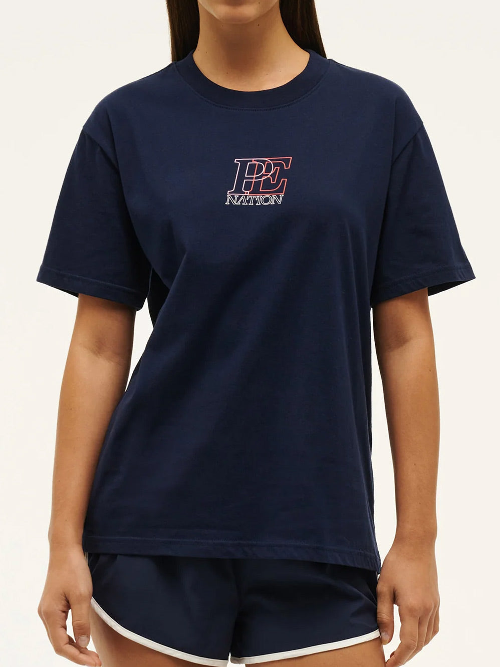 Image of a model wearing Tops. Productname: P.E NATION DEFINITION TEE in Dark Navy colour by brand - P.E Nation