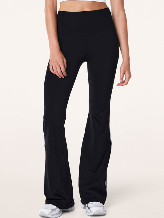 Image of a model wearing Pants. Product name - P.E NATION PREVIEW PIPING LEGGING in Coffee colour by brand - P.E Nation